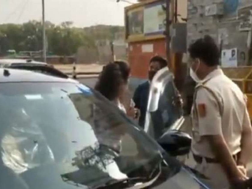 Delhi couple stopped for not wearing mask insults cops video viral | आले भीक मागायला! संचारबंदीत कार रोखताच महिलेचा पोलिसांशी वाद; VIDEO व्हायरल