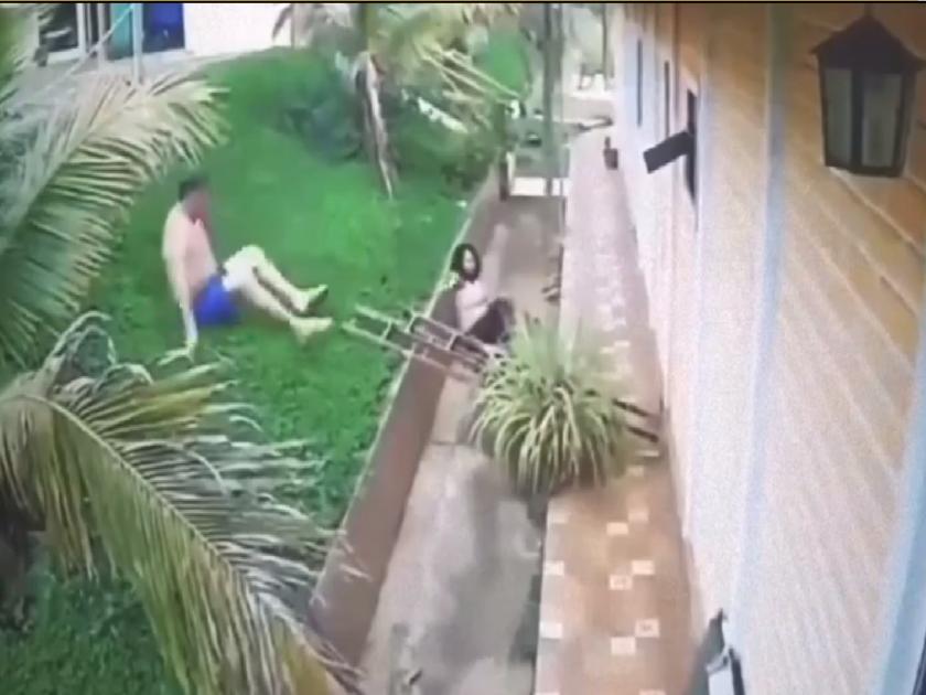 VIDEO: Wife falls off roof after losing balance; Her husband also jumped to save her | VIDEO: तोल गेल्याने पत्नी छतावरुन खाली पडली; तिला वाचवण्यासाठी पतीनेही मारली उडी...
