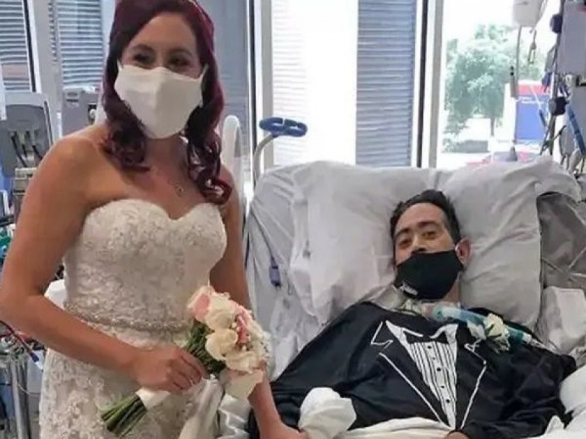 Man got covid marrying the love of his life in hospital news from America | कोरोना झालेल्या व्यक्तीचं हॉस्पिटलमध्येच लावून दिलं लग्न, व्हिडीओ व्हायरल