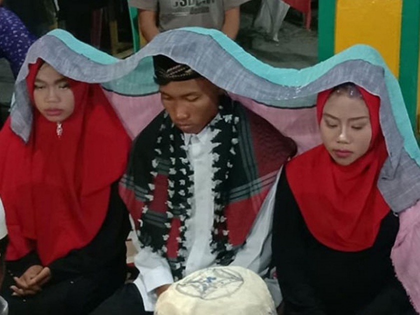 Indonesian man married with two girlfriends at the same time news goes viral | बोंबला! एकाच मांडवात पठ्ठ्याने दोन गर्लफ्रेन्डसोबत केलं लग्न, कारण वाचाल तर जागेवरच 'उडाल'!