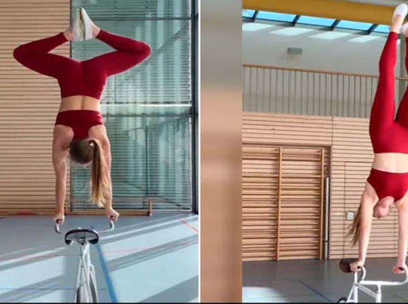 Woman does yoga on a moving bicycle doing amazing stunts by spreading her hands in the air watch video | Yoga on a moving bicycle : बाबो! चालत्या सायकलवर योगा करतेय तरूणी; हवेत हात पसरवून सुरू होतात स्टंट; पाहा व्हिडीओ
