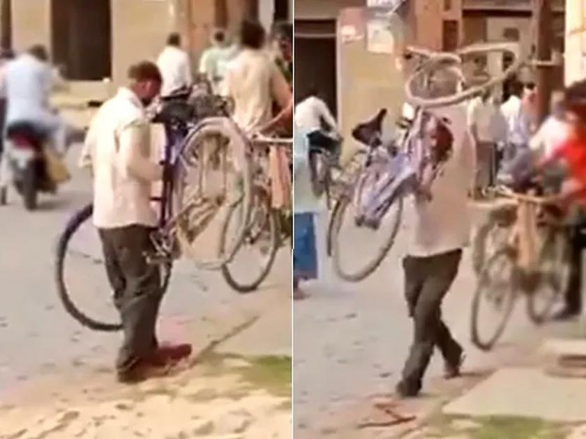 Viral Video : Drunk man forgot to ride bicycle video goes viral | Drunk man Viral Video : बाबो! दारूड्यानं डोक्यावर सायकल उचली अन् झूम...झूम....; व्हिडीओ पाहून पोट धरून हसाल