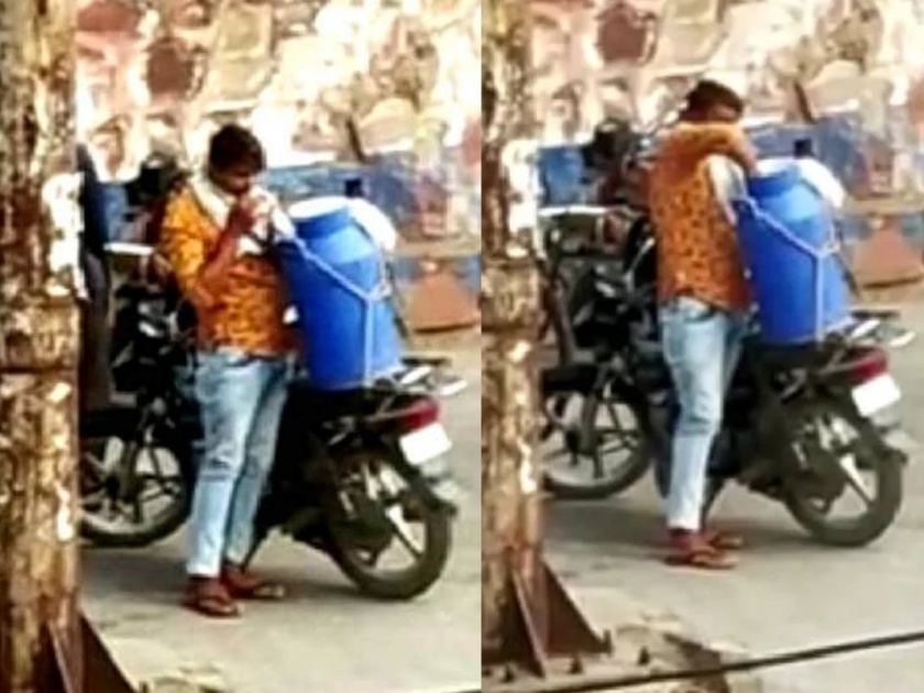 Milkman teeth milk tank video goes viral covid 19 bharatpur rajasthan myb | दुधवाल्यामुळे नागरिकांच्या जीवाशी खेळ; पिशवी दाताने फोडून संपूर्ण शहराला पूरवतो दूध