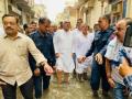 Hooda walks through knee-deep waters in Rohtak - Hindi News | Hooda walks through knee-deep waters in Rohtak | Latest politics News at Lokmattimes.com