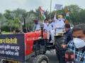 Rahul drives tractor to Parliament, demands withdrawal of 3 farm laws - Hindi News | Rahul drives tractor to Parliament, demands withdrawal of 3 farm laws | Latest politics News at Lokmattimes.com