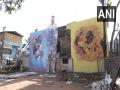 Kerala: Daily wage workers paint their colony to celebrate FIFA WC - Hindi News | Kerala: Daily wage workers paint their colony to celebrate FIFA WC | Latest football News at Lokmattimes.com