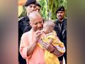 Uttar Pradesh CM Adityanath performs 'annaprashan' for daughter of divyang sweeper in Gorakhpur - Hindi News | Uttar Pradesh CM Adityanath performs 'annaprashan' for daughter of divyang sweeper in Gorakhpur | Latest national News at Lokmattimes.com