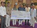 Somnath Trust presents Rs 1.08 crore cheque to Gir-Somnath district administration in presence of Gujarat CM - Hindi News | Somnath Trust presents Rs 1.08 crore cheque to Gir-Somnath district administration in presence of Gujarat CM | Latest national News at Lokmattimes.com