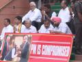 Parliament Budget Session: Oppn MPs stage protest at Makar Dwar, hold 'PM is compromised' banner - Hindi News | Parliament Budget Session: Oppn MPs stage protest at Makar Dwar, hold 'PM is compromised' banner | Latest politics News at Lokmattimes.com