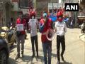 Volunteers wear virus-shaped helmets to create awareness about following Covid protocols in Jammu - Hindi News | Volunteers wear virus-shaped helmets to create awareness about following Covid protocols in Jammu | Latest national News at Lokmattimes.com