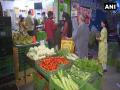 Customers in Patparganj practice social distancing while buying essentials - Hindi News | Customers in Patparganj practice social distancing while buying essentials | Latest national News at Lokmattimes.com