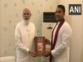 Sri Lankan's Namal Rajapaksa meets PM Modi, gifts Sinhala version of Bhagavad Gita - Hindi News | Sri Lankan's Namal Rajapaksa meets PM Modi, gifts Sinhala version of Bhagavad Gita | Latest international News at Lokmattimes.com
