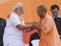 PM Modi greets CM Yogi Adityanath, UP ministers on taking oath - Hindi News | PM Modi greets CM Yogi Adityanath, UP ministers on taking oath | Latest politics News at Lokmattimes.com