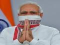 Donning 'gamcha' mask, PM gives safety message with new social media display picture - Hindi News | Donning 'gamcha' mask, PM gives safety message with new social media display picture | Latest national News at Lokmattimes.com