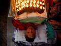 Devotees thank gods by covering body with cow dung, lit oil-lamps in Nepal - Hindi News | Devotees thank gods by covering body with cow dung, lit oil-lamps in Nepal | Latest international News at Lokmattimes.com