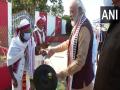 Manipur: PM Modi tries his hand at playing traditional musical instruments during visit to Imphal - Hindi News | Manipur: PM Modi tries his hand at playing traditional musical instruments during visit to Imphal | Latest politics News at Lokmattimes.com