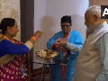 South Africa: Women members of Indian diaspora tie 'Rakhi' to PM Modi in Johannesburg - Hindi News | South Africa: Women members of Indian diaspora tie 'Rakhi' to PM Modi in Johannesburg | Latest international News at Lokmattimes.com