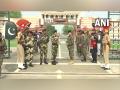 BSF, Pakistan Rangers exchange sweets at Attari-Wagah border on occasion of Eid Al-Adha - Hindi News | BSF, Pakistan Rangers exchange sweets at Attari-Wagah border on occasion of Eid Al-Adha | Latest national News at Lokmattimes.com