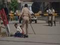 Cop suspended in UP's Hapur for beating labourers, making them roll on road - Hindi News | Cop suspended in UP's Hapur for beating labourers, making them roll on road | Latest national News at Lokmattimes.com