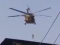 Post US exit from Afghanistan, video surfaces of Taliban flying US chopper with man dangling from rope - Hindi News | Post US exit from Afghanistan, video surfaces of Taliban flying US chopper with man dangling from rope | Latest international News at Lokmattimes.com