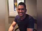 Check out how Dhoni reacted after air hostess served him chocolates with a note