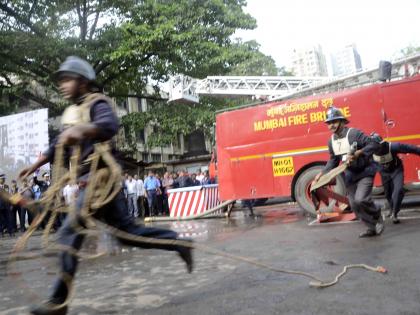 Mumbai: 2 infants, 31 trapped in burning building rescued safely | Mumbai: 2 infants, 31 trapped in burning building rescued safely Mumbai: 2 infants, 31 trapped in burning building rescued safely | Mumbai: 2 infants, 31 trapped in burning building rescued safely