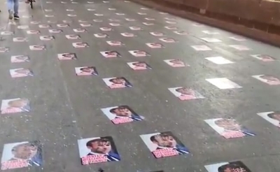 Police remove posters of Macron pasted on Mumbai road | Police remove posters of Macron pasted on Mumbai road