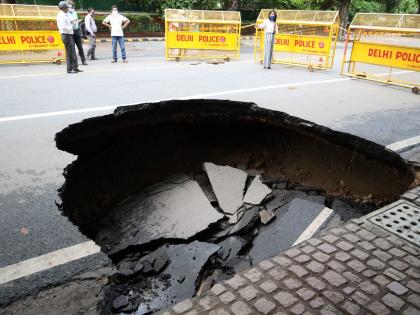 Portion of road caves in South Delhi | Portion of road caves in South Delhi