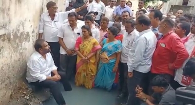 Andhra's ruling party MLA enters drain in novel protest | Andhra's ruling party MLA enters drain in novel protest