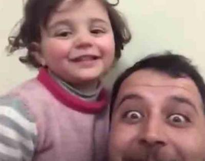 Syrian toddler who laughed at bombs reaches Turkey with family | Syrian toddler who laughed at bombs reaches Turkey with family Syrian toddler who laughed at bombs reaches Turkey with family | Syrian toddler who laughed at bombs reaches Turkey with family