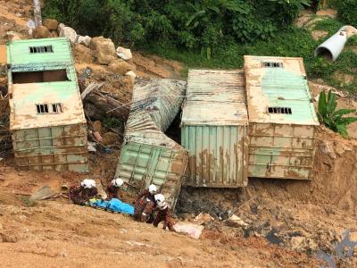 2 dead, dozens trapped in Malaysian landslide | 2 dead, dozens trapped in Malaysian landslide