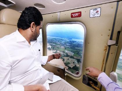 Andhra CM conducts aerial survey of flood-hit areas | Andhra CM conducts aerial survey of flood-hit areas