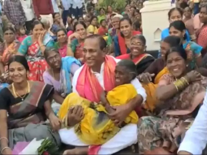 Telangana minister lifts elderly woman in arms during campaign | Telangana minister lifts elderly woman in arms during campaign