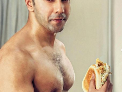 Varun Dhawan chomps on burgers, flaunts his abs on 'cheat day' | Varun Dhawan chomps on burgers, flaunts his abs on 'cheat day'