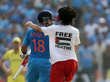 Pitch invader wearing 'Free Palestine' T-shirt hugs Kohli | Pitch invader wearing 'Free Palestine' T-shirt hugs Kohli