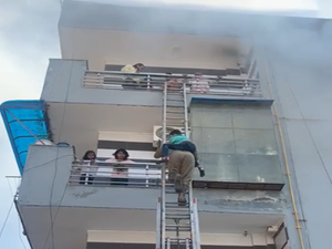 Man, child rescued from Delhi house fire | Man, child rescued from Delhi house fire Man, child rescued from Delhi house fire | Man, child rescued from Delhi house fire