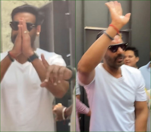 Ajay Devgn greets fans with a namaste outside his residence in Mumbai on 55th b'day | Ajay Devgn greets fans with a namaste outside his residence in Mumbai on 55th b'day