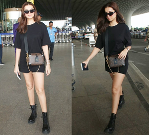 Off to London, Tara Sutaria flaunts cool chic look in black oversized tee, shorts & boots | Off to London, Tara Sutaria flaunts cool chic look in black oversized tee, shorts & boots