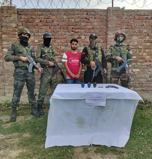 Terror associate arrested, arms, ammunition recovered in J&K's Baramulla | Terror associate arrested, arms, ammunition recovered in J&K's Baramulla Terror associate arrested, arms, ammunition recovered in J&K's Baramulla | Terror associate arrested, arms, ammunition recovered in J&K's Baramulla