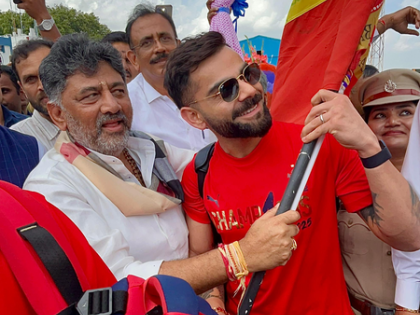 RCB team gets grand welcome at B'luru airport, Shivakumar gifts Kannada flag to Virat Kohli | RCB team gets grand welcome at B'luru airport, Shivakumar gifts Kannada flag to Virat Kohli