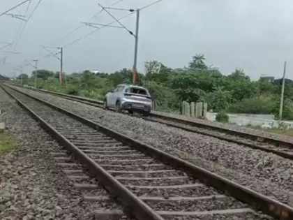 Woman drives car on railway track in Telangana | Woman drives car on railway track in Telangana Woman drives car on railway track in Telangana | Woman drives car on railway track in Telangana