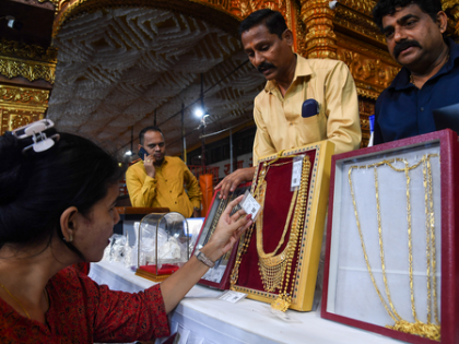 Gold reaches record high, poised for best month in 14 years | Gold reaches record high, poised for best month in 14 years