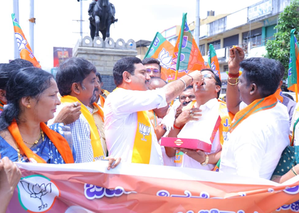 K'taka BJP celebrates GST reforms with bursting of firecrackers, distribution of sweets | K'taka BJP celebrates GST reforms with bursting of firecrackers, distribution of sweets
