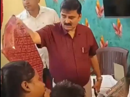 Video shows cop distributing sarees gifted by CM; Suvendu Adhikari says Mamata Police | Video shows cop distributing sarees gifted by CM; Suvendu Adhikari says Mamata Police