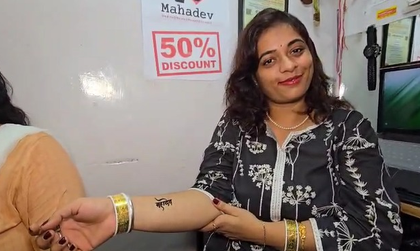 Women in Varanasi promote 'I Love Mahadev' tattoos amid rising tensions | Women in Varanasi promote 'I Love Mahadev' tattoos amid rising tensions