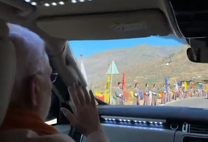 Bhutanese citizens line 45-km route with flags, cheers for PM Modi | Bhutanese citizens line 45-km route with flags, cheers for PM Modi