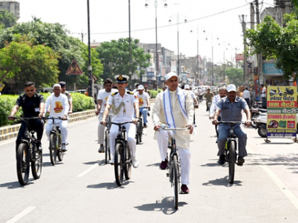 Gujarat Governor cycles to Gurukul after train journey, urges fuel conservation | Gujarat Governor cycles to Gurukul after train journey, urges fuel conservation Gujarat Governor cycles to Gurukul after train journey, urges fuel conservation | Gujarat Governor cycles to Gurukul after train journey, urges fuel conservation