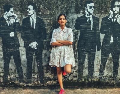 Kubbra Sait shares a cool picture against a wall mural | Kubbra Sait shares a cool picture against a wall mural