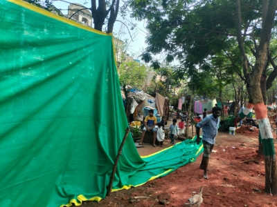 Slums near Vizag airport 'covered' for G20 meet | Slums near Vizag airport 'covered' for G20 meet