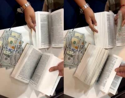 Man hiding $90,000 between book pages held at Mumbai airport | Man hiding $90,000 between book pages held at Mumbai airport